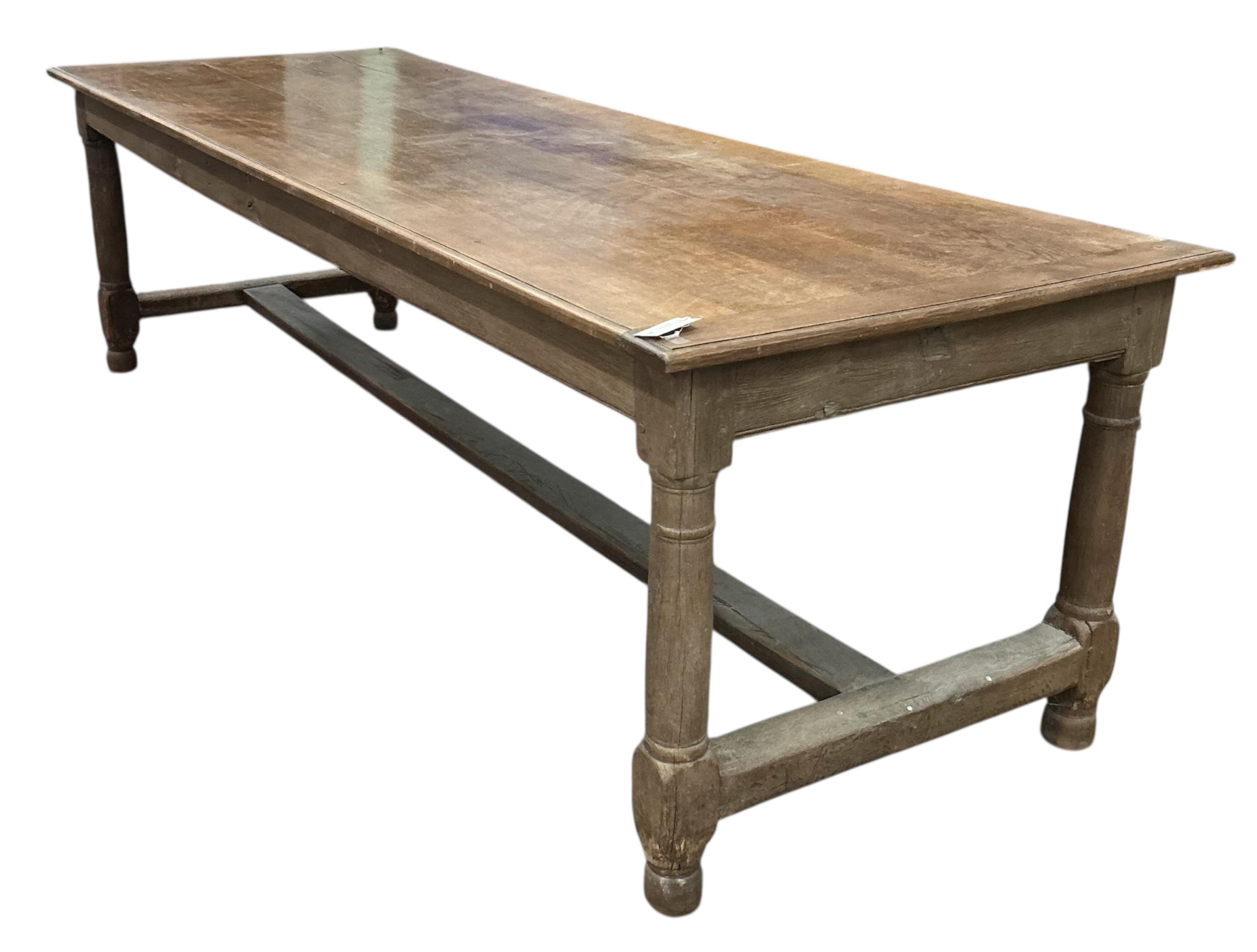 A late 19th century French oak rectangular refectory table, width 258cm, depth 88cm, height 75cm